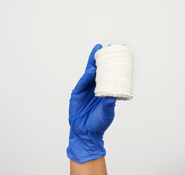 hand hold stack of white cotton round discs for cosmetic procedures on a white background