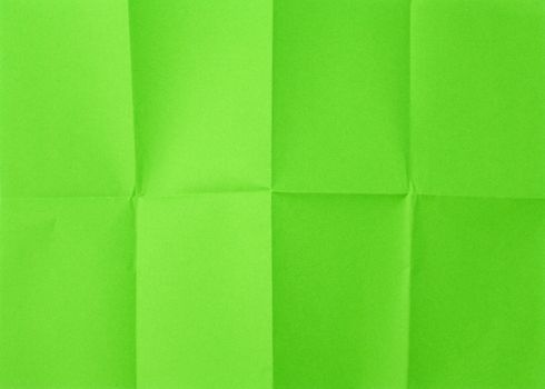 empty green sheet of paper with creases full frame, close up