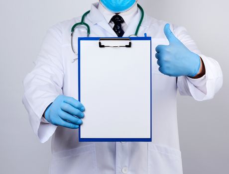 male doctor in a white coat, blue latex gloves, stethoscope hanging on his neck, doctor holding a paper holder with a white blank sheet, place for writing a prescription and text