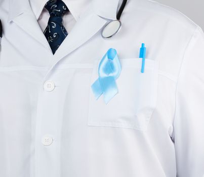 on the pocket pinned a blue ribbon in the shape of a loop, symbol of the fight and treatment of prostate cancer