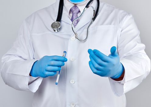 doctor in a white coat with buttons and blue latex gloves holds out his hand forward, concept of invitation, handshake, white background