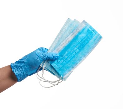 hands holds a medical face medical mask against viruses and bacteria on a white background, protective medical tool