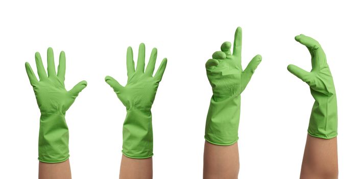 green rubber glove for cleaning is dressed on the hand, palm is open and conditionally holds the item, set