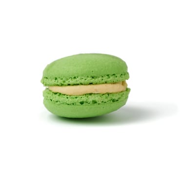 green round baked almond flour macaron isolated on a white background, delicious popular french dessert