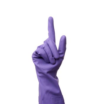 purple rubber glove for cleaning is dressed on the hand, protection of the hands from chemicals, index finger raised, isolated white background