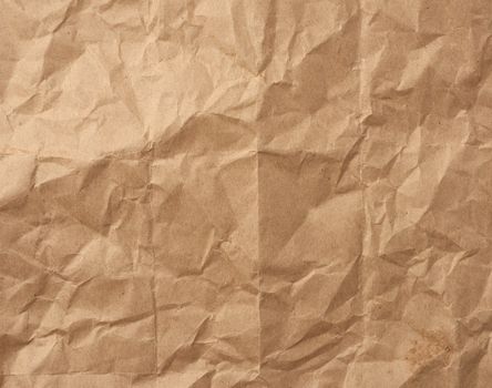 fragment of crumpled blank sheet of brown wrapping kraft paper, vintage texture for the designer, full frame