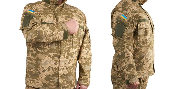 Ukrainian man warrior dressed in a military pixel uniform stands on a white background, soldier put a hand to his chest as a sign of respect, honor of the state symbol