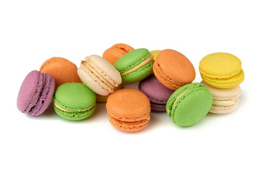 round baked multi-colored almond flour cakes macarons, dessert isolated on a white background, close up