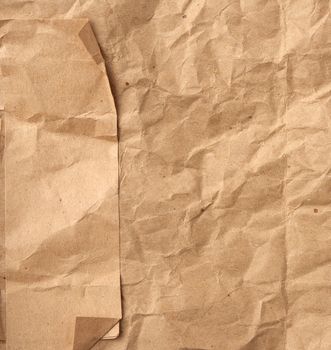 fragment of crumpled blank sheet of brown wrapping kraft paper, vintage texture for the designer, full frame