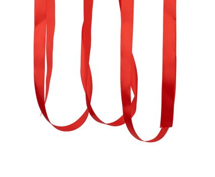 hanging red silk ribbon for packing gifts isolated on a white background, close up