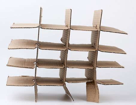 brown cardboard partition for a box, a subject for transporting bottles on a white background