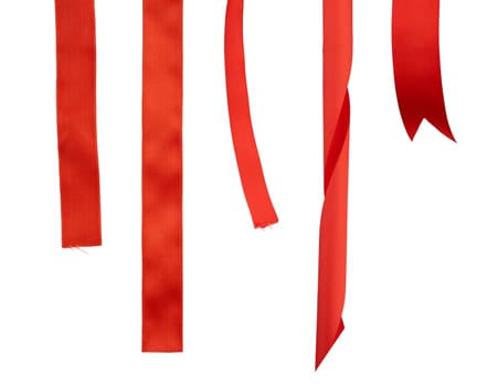 different ends of red silk ribbon isolated on white background, close up