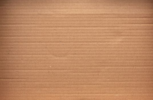 piece of smooth brown cardboard paper, full frame, close up