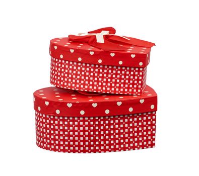 red heart-shaped cardboard box with bow isolated on white background, holiday gift wrapping