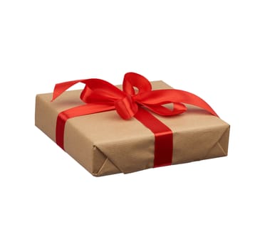 square box wrapped in brown kraft paper and tied with a silk red ribbon, side view, gift isolated on a white background