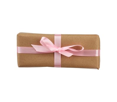 box wrapped in brown kraft paper and tied with a pink ribbon, gift isolated on a white background, element for a designer