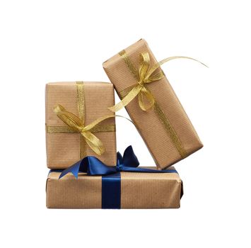 stack of gifts wrapped in brown kraft paper and tied with a silk blue ribbon and golden isolated on a white background, element for a designer