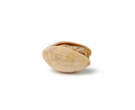 fried salted pistachio isolated on a white background, close-up