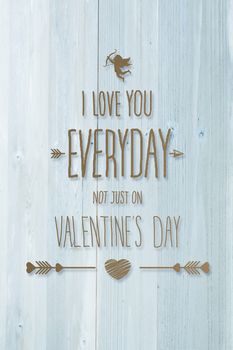 Valentines day greeting against bleached wooden planks background