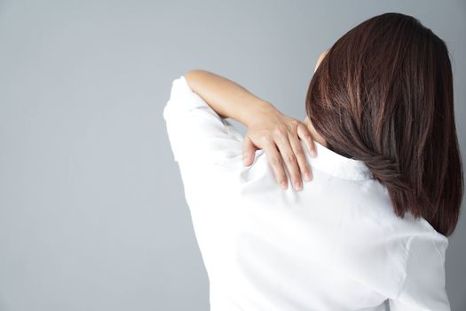 Closeup woman holding neck with pain, healthy care and medical concept