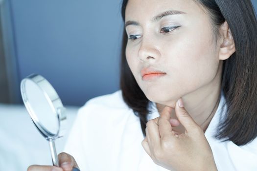 Close up face of woman looking the mirror with happy feeling, health care and beauty concept