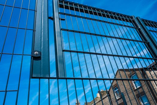 Black metal security gates protecting business property