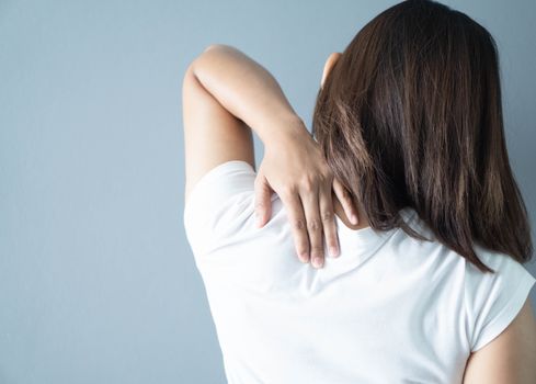 Closeup woman holding neck with pain, healthy care and medical concept