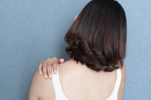 Closeup woman holding neck with pain, healthy care and medical concept