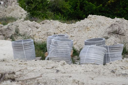 Iron concrete rings. Construction of a sewerage system.