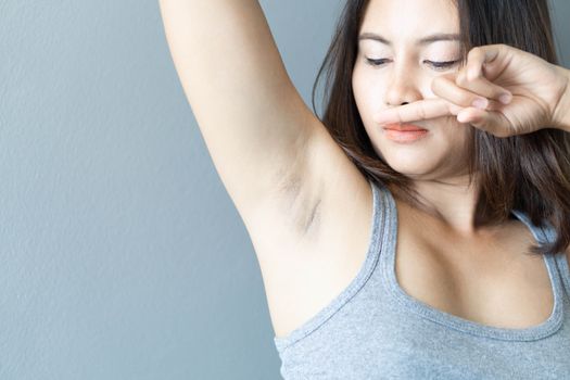 Women problem black armpit with grey background for skin care and beauty concept, selective focus