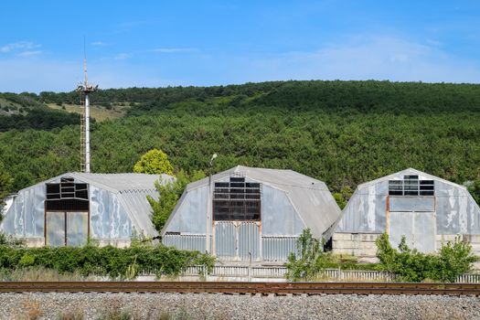 corrugated galvanized iron hangar. a Construction base.