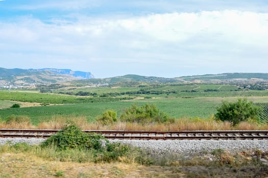 The railway among the hills and fields of the Crimean.