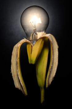 Lampanana, banana lamp bulb with dark background, vertical image