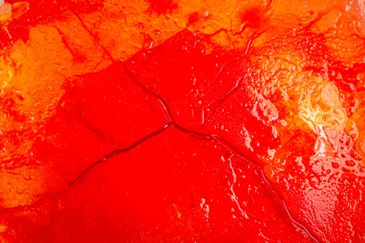 Image of blood-colored liquids mixed with other organic fluids, abstract chemical detail