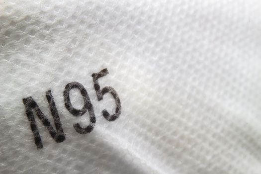 A close up to a N95 sign on a face mask ppe