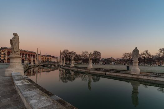 Prato della Valle, square in the city of Padua with the Memmia island surrounded by a canal surrounded by 87 statues, Italian cityscape