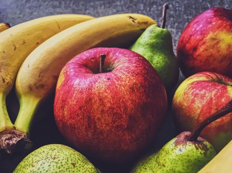 Organic apples, pears and bananas on rustic linen background, fruits farming and agriculture