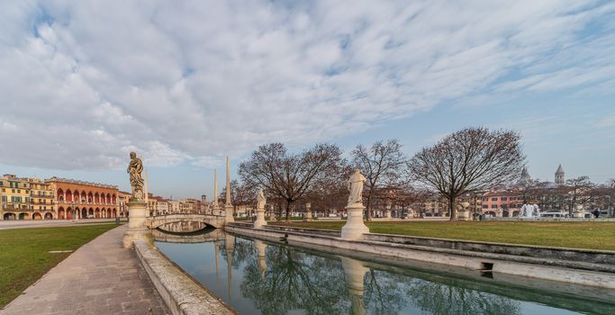 Prato della Valle, square in the city of Padua with the Memmia island surrounded by a canal surrounded by 87 statues, Italian cityscape