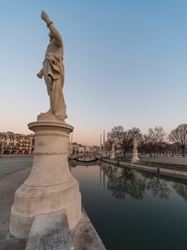 Prato della Valle, square in the city of Padua with the Memmia island surrounded by a canal surrounded by 87 statues, Italian cityscape