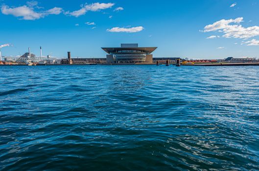 Copenhagen Opera House at dusk, horizontal image of building on water, contemporary European architecture