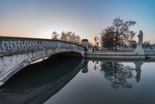 Prato della Valle, square in the city of Padua with the Memmia island surrounded by a canal surrounded by 87 statues, Italian cityscape