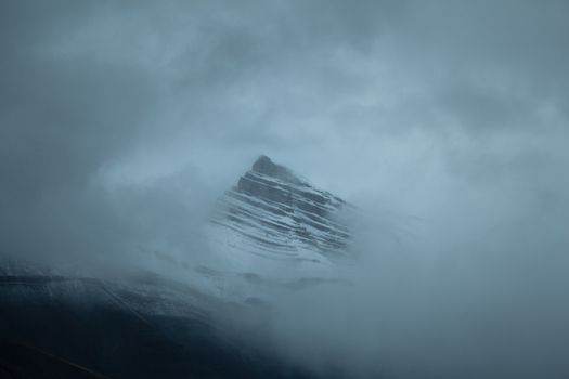 Nigel SE3 peak framed with clouds, Canadian Rockies, Alberta, Canada