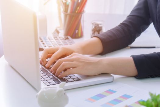 A young business woman using laptop computer on the table, Looking for direction and inspiration.