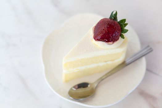 Closeup Milk cake delicious on glass table background, selective focus