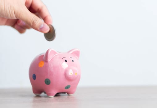 Pink ceramic piggy bank on white background, saving money concept