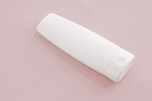 Moisturizing hand cream or body lotion on pink background, beauty product and skin care cosmetics, flatlay