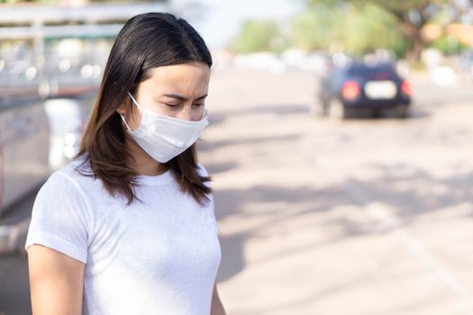 Closeup woman wearing face mask for protect air polution, health care and medical concept