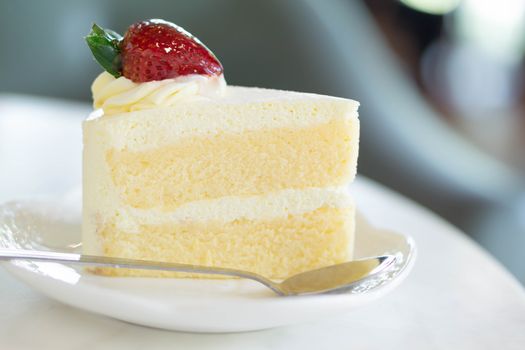 Closeup Milk cake delicious on glass table background, selective focus