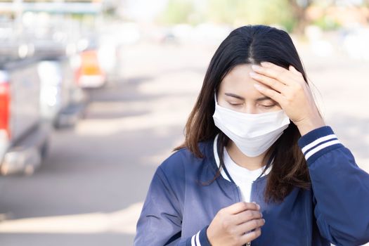 Closeup woman wearing face mask for protect air polution, health care and medical concept