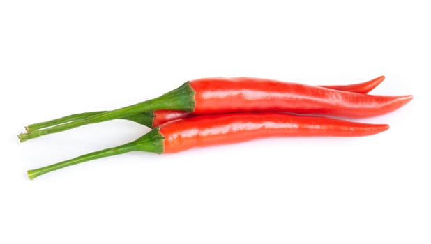 Closeup chilli pepper on white background, raw food ingredient concept